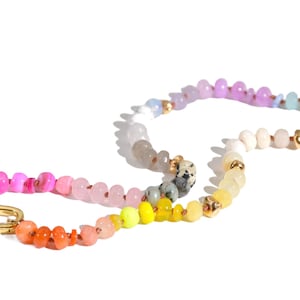Candy Colored Long Beaded Gem Necklace featuring neon colored rainbow gemstones and opal rainbow beads. 
 It is a beautiful Boho Chic Statement Necklace for the Summer in colors of bright neon pinks , purples, oranges, pastels and yellows.
