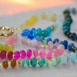 A rainbow multi-gemstone necklace that is handknotted   & handcrafted.  Made from natural semi precious gemstones.  This necklace is sure to add a pop of color to any outfit
