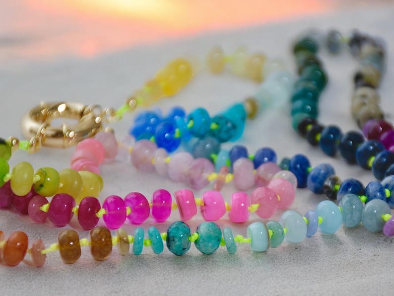 A rainbow multi-gemstone necklace that is handknotted   & handcrafted.  Made from natural semi precious gemstones.  This necklace is sure to add a pop of color to any outfit