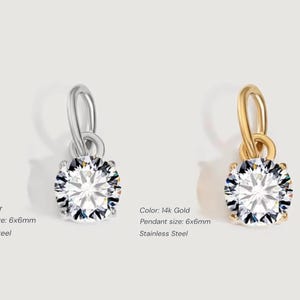 Gold diamond crystal charm displayed on a white background, each featuring a round cut The clear faceted stones shimmer in the light, framed in gold settings with looped bails for attaching to necklaces or bracelets. Elegant minimalist photo showing jewelry-making pendants available in both gold and silver options.  Perfect for diy jewelry to use as add-on charms for any charm necklace or charm bracelet.