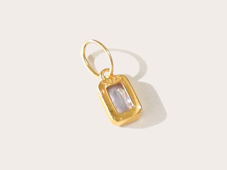 Gold birthstone charms featuring bezel-set gemstones for each month, designed for custom necklaces and bracelets.  14k gold vermeil 925 Sterling silver