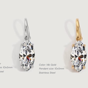 Gold diamond crystal charm displayed on a white background, each featuring a marquise cut The clear faceted stones shimmer in the light, framed in gold settings with looped bails for attaching to necklaces or bracelets. Elegant minimalist photo showing jewelry-making pendants available in both gold and silver options.  Perfect for diy jewelry to use as add-on charms for any charm necklace or charm bracelet.