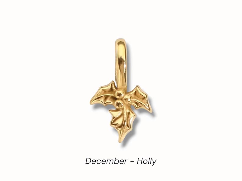 Gold birth flower charm representing each month, featuring a delicate embossed floral design on a round gold pendant — a personalized jewelry gift for her.