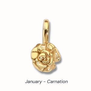 Gold birth flower charm representing each month, featuring a delicate embossed floral design on a round gold pendant — a personalized jewelry gift for her.