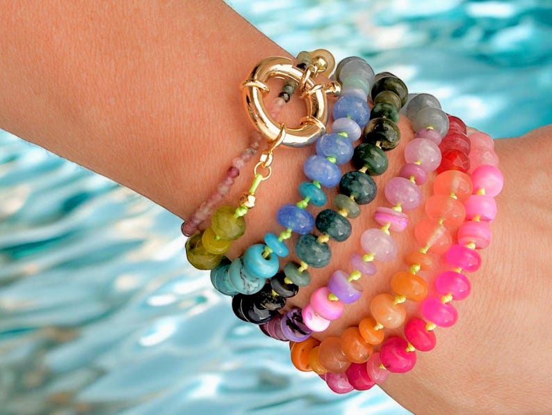 A rainbow multi-gemstone necklace that is handknotted   & handcrafted.  Made from natural semi precious gemstones.  This necklace is sure to add a pop of color to any outfit