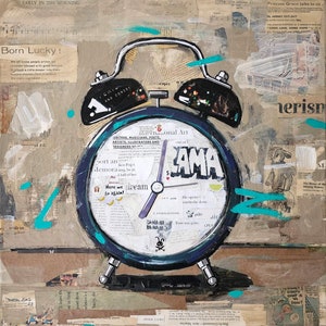May include: A blue alarm clock with a white face and black hands. The clock is surrounded by colorful paper scraps with text, including the words "Born Lucky!" and "Here we dream again!"