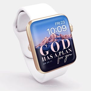 May include: A white Apple Watch with a gold band and a pink and white digital watch face that says "GOD HAS A PLAN for you" and "JER 29:11".