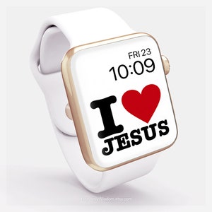 May include: White Apple Watch with a gold band and a white face. The face displays the time "10:09" and the date "FRI 23". The watch face also has a red heart and the text "I LOVE JESUS".