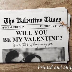 May include: A printable Valentine's Day card with a newspaper design. The headline reads "The Valentine Times" with the subheading "Special Edition" and "February 14, 202.". The text below reads "Will you be my Valentine? You're the best thing in my life!"