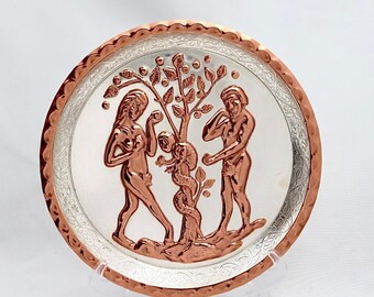 Adam and Eve. Handmade copper hammering with silver plating