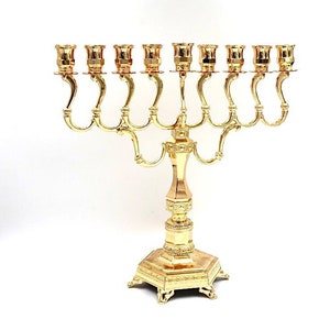 Menorah for Hanukkah made of gold-plated metal