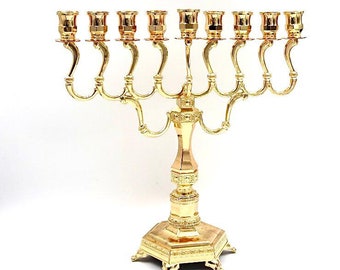 Menorah for Hanukkah made of gold-plated metal