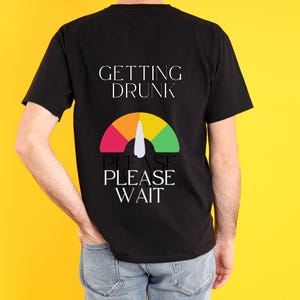 May include: Black t-shirt with the text "GETTING DRUNK" and a graphic of a speedometer with the needle pointing to the red zone. The text "PLEASE PLEASE WAIT" is below the speedometer.
