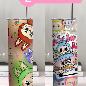 May include: Two stainless steel tumblers with colorful cartoon character designs. One tumbler features a red and brown character with candy graphics, while the other has a pink car and multiple characters. The text "2 FREE Labubuu" is above.