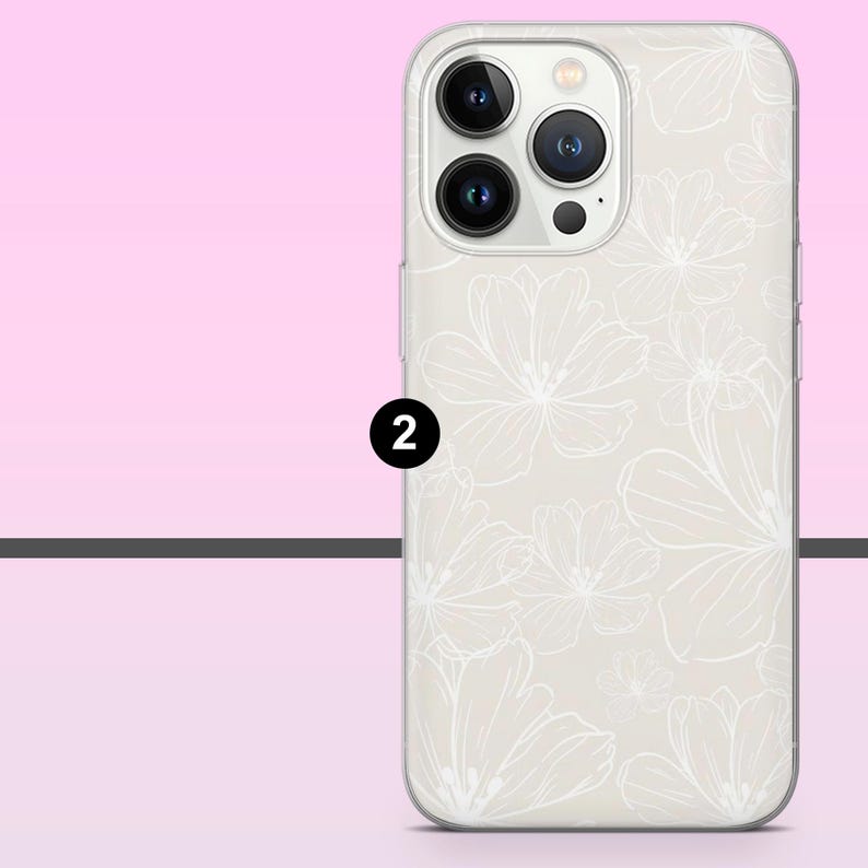 May include: A phone case with a floral design. The case is off-white with a pattern of white flowers. The phone case has a camera module with three lenses. The number 2 is printed in black on the side of the phone case.