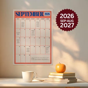 May include: A wall calendar for September 2026 with a red border and blue text. The grid contains handwritten notes for daily tasks. A separate dark red circular badge displays the text 2026 SEP-AUG 2027 in white, sans-serif lettering.