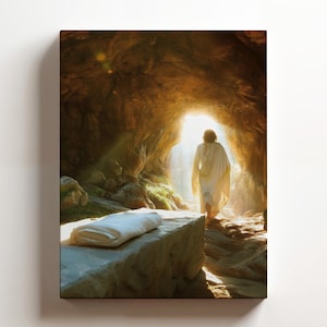 May include: A person in a white robe walks out of a cave towards a bright light. A white cloth lies on a rock in the foreground.
