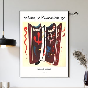 May include: A poster featuring an abstract painting by Wassily Kandinsky titled "Brown with Supplement" from 1915. The painting features geometric shapes in shades of red, blue, yellow, and black on a light yellow background.