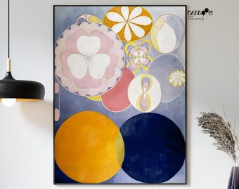 May include: Abstract artwork print with a design of overlapping circles in different sizes and colours. The piece features a large pink and white floral design, a bright yellow circle, and a deep blue circle, set against a muted blue backdrop. The artwork is framed in black.