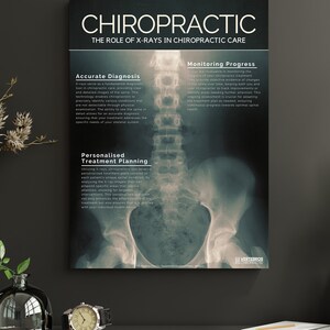 May include: A black and white X-ray image of a human spine, pelvis, and hips. The image is framed and hanging on a wall. The text "CHIROPRACTIC" is at the top of the frame, and the text "THE ROLE OF X-RAYS IN CHIROPRACTIC CARE" is below it. The text "Accurate Diagnosis", "Monitoring Progress", and "Personalized Treatment Planning" is on the left side of the image, describing the benefits of using X-rays in chiropractic care.
