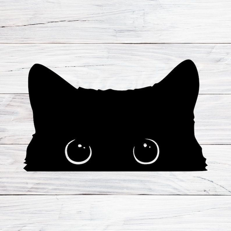 May include: A black silhouette of a cat's face peeking over a white wooden surface. The cat's eyes are visible and the cat's ears are pointed.