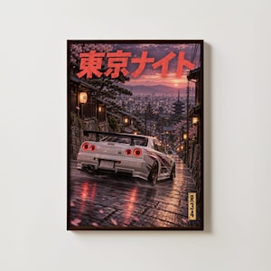 May include: A framed wall art print featuring a white sports car on a wet cobblestone street at dusk. The scene includes traditional Japanese architecture, cherry blossoms, and a city skyline. The text Tokyo Night is in red, with R34 at the bottom.