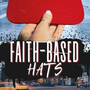 May include: A beige and red baseball cap with a tiger graphic and the text "Jesus is my rock, he is how I roll". The cap is held in a hand against a blurred city background. The text "Faith-based hats" is in the foreground.