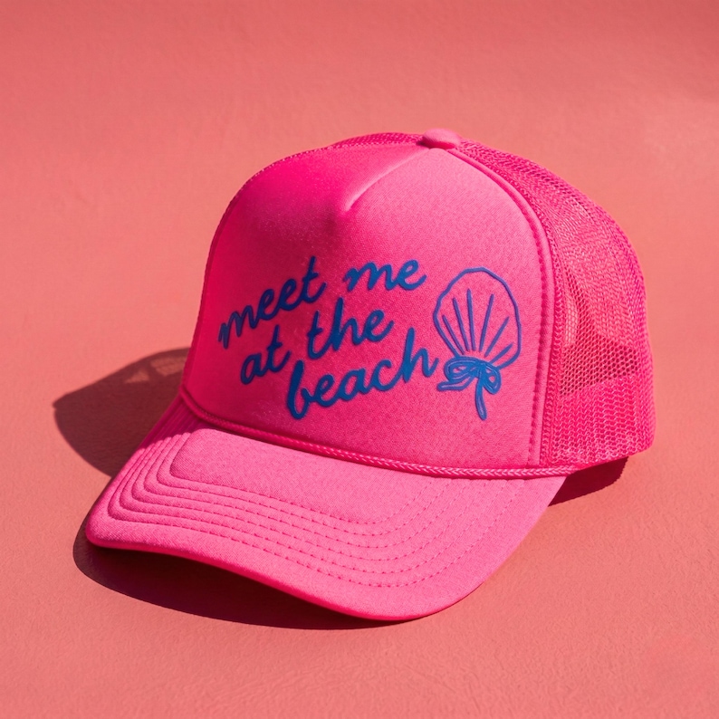 Neon pink trucker hat with "meet me at the beach design" in blue puff vinyl trucker hat for beach girls trip