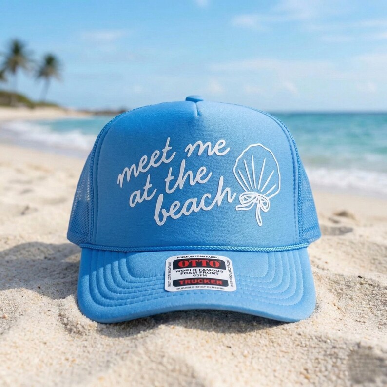 Blue trucker hat with Meet Me at the Beach puff vinyl lettering in script font summer beach accessory casual outdoor fashion