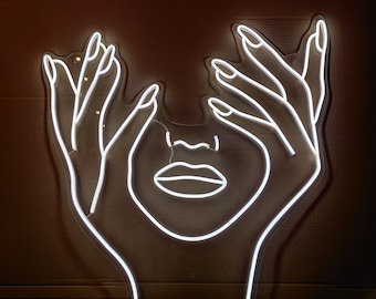 Neon z napisem "Kobieta z paznokciami" dla salonu kosmetycznego lub salonu pielęgnacji paznokci
