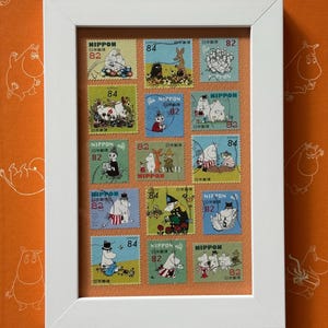 Framed Japanese Moomin stamps, green-blue-orange
