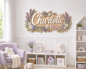 May include: A wooden wall sign featuring the name Charlotte Rose in white and pink 3D lettering, surrounded by sculpted lavender sprigs and white daisies. The sign is mounted on a light-colored wall above a white four-cubby storage unit.