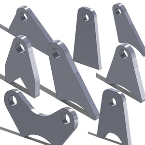 May include: A set of eight metal brackets with holes for attaching to other objects. The brackets are made of a silver-colored metal and have a variety of shapes and sizes.