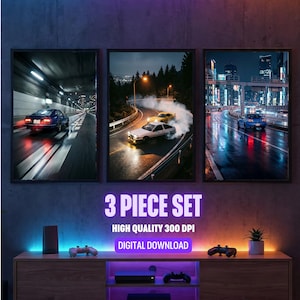 May include: A three-piece set of framed wall art featuring dynamic car scenes. The images depict cars drifting on wet roads at night, with cityscapes and tunnels in the background. The text "3 PIECE SET" is displayed prominently.