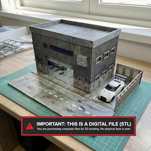 May include: A miniature model of a garage with a white sports car parked outside. The garage has a corrugated metal exterior and a large opening. The model includes a road and a fence. Text on the image reads: IMPORTANT: THIS IS A DIGITAL FILE (STL).