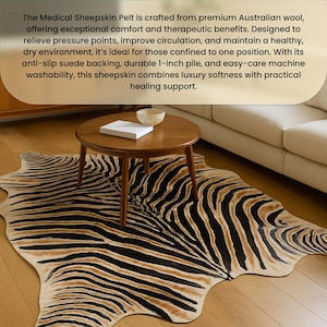 May include: A zebra-striped rug with black and tan patterns. A small, round wooden table with a book and a bowl sits on top of the rug. The rug is on a wooden floor.