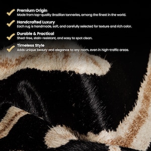 May include: Close-up of a rug with a black and tan zebra stripe pattern. The rug has a soft texture and is made from high-quality materials. The image also includes text that describes the rug's features, such as its premium origin and timeless style.