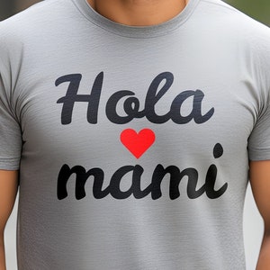 May include: A gray t-shirt with the text "Hola mami" in black lettering and a red heart.