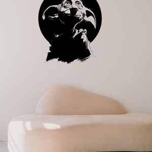 May include: A black and white graphic illustration of a creature with large ears and wide eyes, set against a solid black circular background. The design features high-contrast ink-style strokes and is presented as a digital file format set.