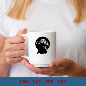 May include: A white ceramic mug featuring a black and white graphic illustration of a small creature with large ears and wrinkled skin centered within a solid black circle. The mug has a smooth finish and a curved handle on the left side.
