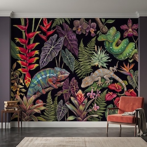 May include: A wall mural featuring a dark background with a vibrant jungle scene. The design includes a colorful chameleon, a green snake, and a gecko surrounded by various tropical plants, including red heliconia, ferns, and purple orchids.