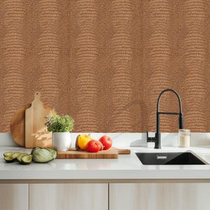May include: A kitchen scene featuring a brown textured wall, a white countertop, and a black faucet. Wooden cutting boards, a white ceramic pot with herbs, and fresh produce including tomatoes, a yellow bell pepper, and avocado are arranged on the counter.