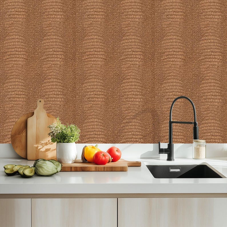 May include: A kitchen scene featuring a brown textured wall, a white countertop, and a black faucet. Wooden cutting boards, a white ceramic pot with herbs, and fresh produce including tomatoes, a yellow bell pepper, and avocado are arranged on the counter.