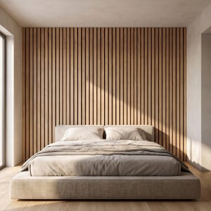 May include: A low-profile platform bed with light beige bedding and two matching pillows positioned against a wall covered in vertical light wood slats with dark recessed gaps, creating a linear pattern across the entire wall surface.