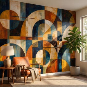 Pode incluir: Um mural geométrico abstrato em tons de azul, laranja e amarelo. Uma poltrona de couro marrom com uma manta bege está em frente ao mural. Uma mesa lateral de madeira com uma lâmpada e uma planta em vaso completam a cena.