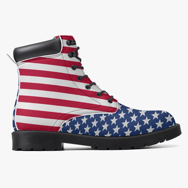 May include: A combat boot featuring the American flag design. The upper part of the boot displays red and white stripes, while the lower part showcases a blue field with white stars. The boot has a black sole, laces, and a black padded collar.