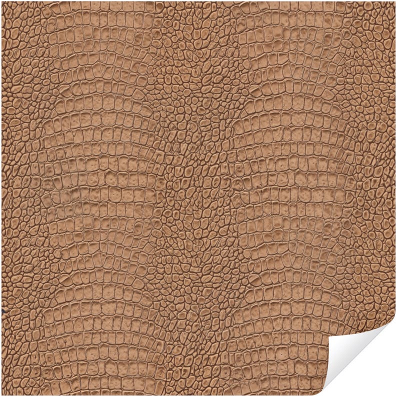 May include: A close-up of a brown, textured surface with a pattern resembling crocodile skin. The surface has a repeating scale-like design, with a slight sheen. The corner of the surface is curled up, revealing a white edge.