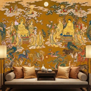 May include: A detailed mural depicting golden figures in flowing robes, set against a mustard-coloured backdrop with clouds, trees, and a full moon. The lower portion shows mythical creatures and animals. A dark wooden sofa with gold cushions frames the scene.