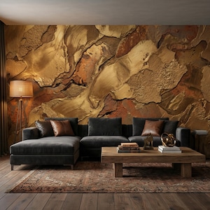 May include: A living room featuring a dark gray sectional sofa with brown leather accent pillows, a wooden coffee table, and a patterned rug. The wall is adorned with a textured, gold and brown mural. A woven floor lamp stands to the left.