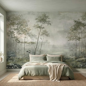 May include: A bedroom with a forest mural, a bed with sage green bedding, and a beige throw blanket. The room has a natural jute rug and a window with a vase of flowers. The overall aesthetic is serene and nature-inspired.